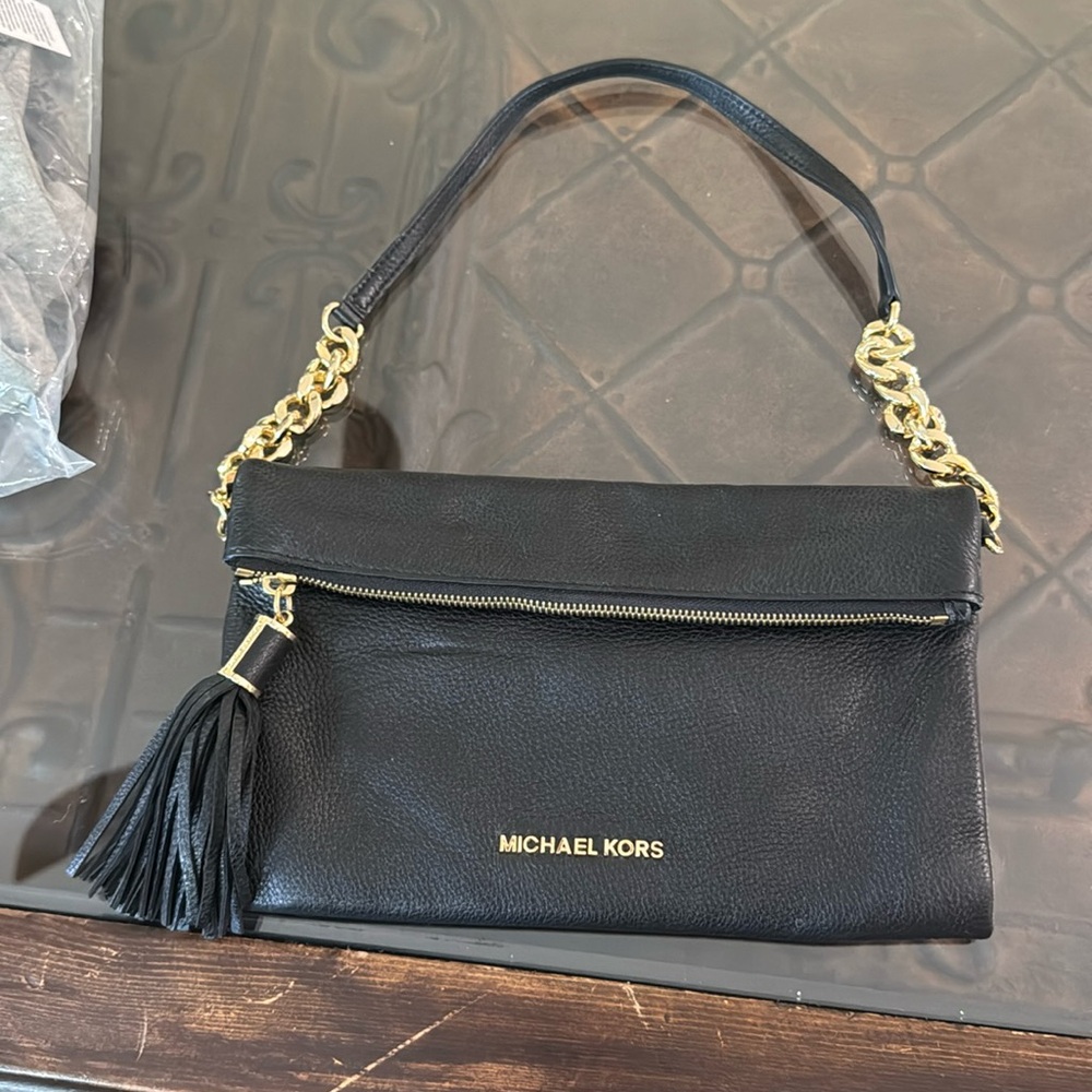 Michael Kors black fold over clutch with gold hardware